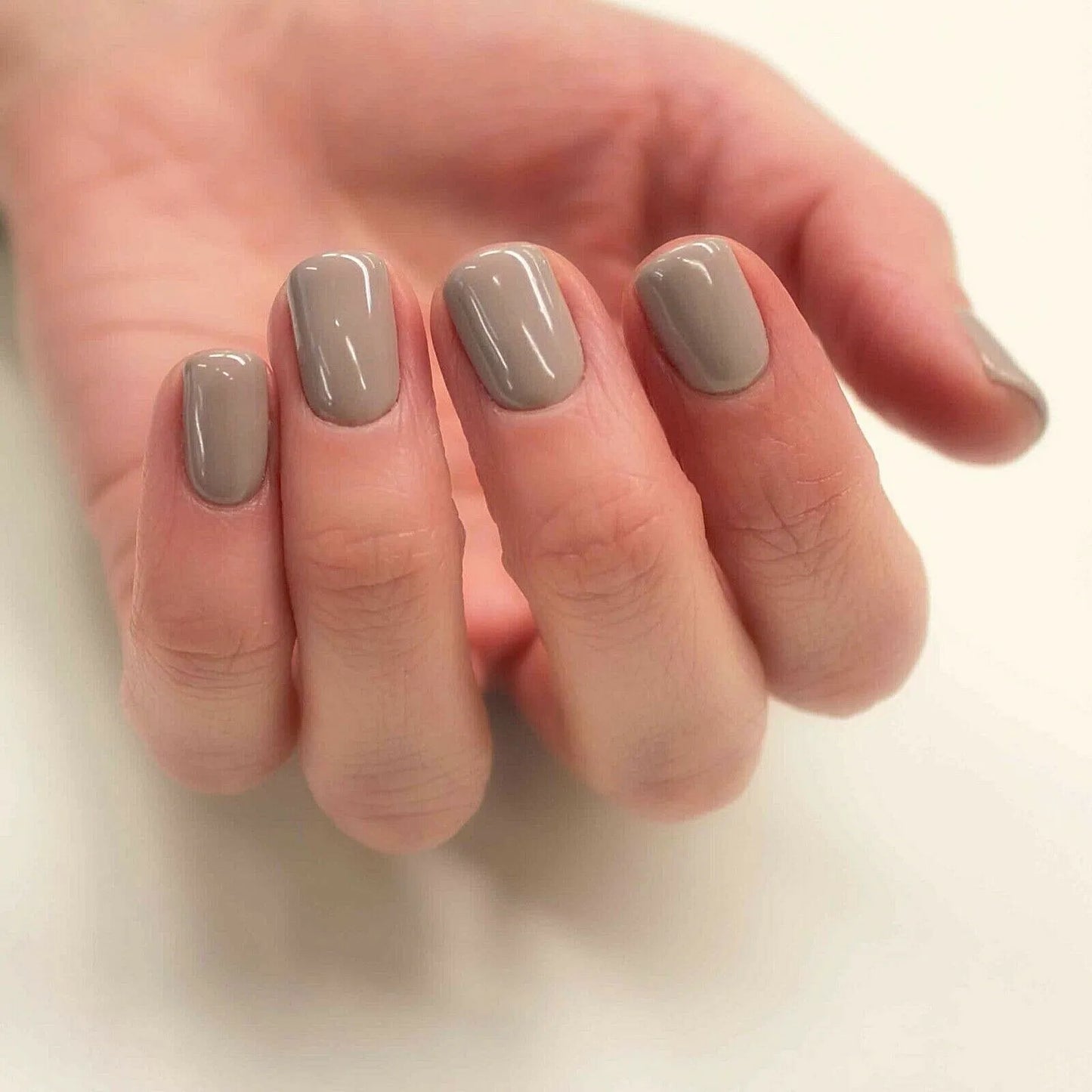 Close-up of Bio Sculpture Gemini Nail Polish No. 122 Ashes of Roses polish on light skin – non-toxic, soft rose mauve shade for a refined, everyday nail look