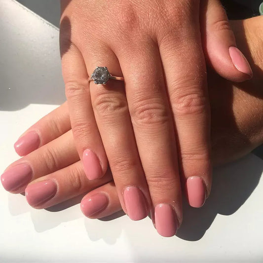 Close-up of Bio Sculpture Gemini Nail Polish No. 126 Savannah Dusk polish on light skin – non-toxic, soft mauve-brown shade for a refined, everyday nail look