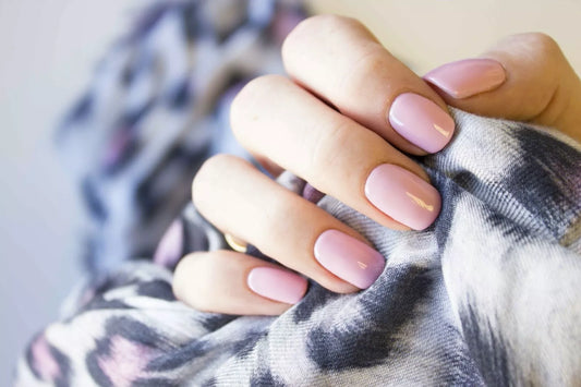 Hand wearing Bio Sculpture Gemini Nail Polish No. 2069 Pink Marshmallow – vegan, baby pink polish for a gentle, elegant nail look