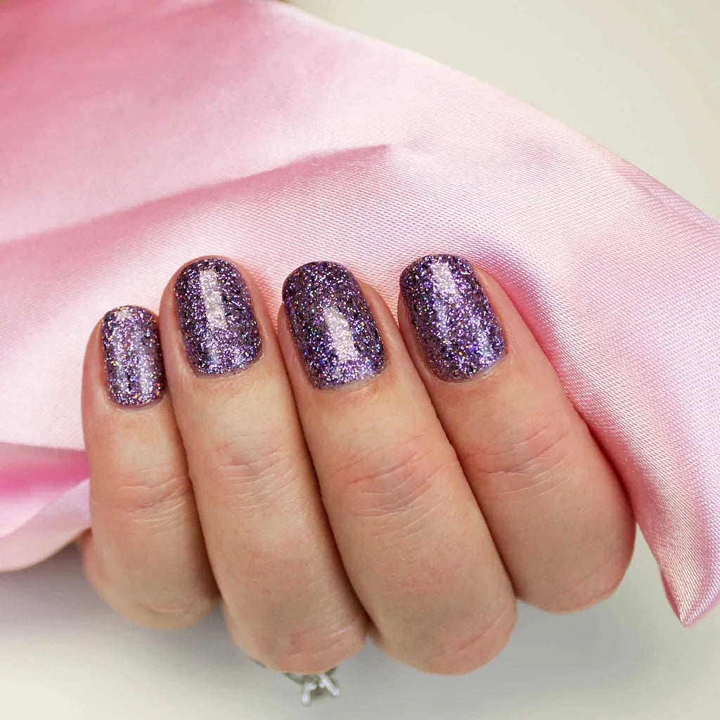 Close-up of Bio Sculpture Gemini Nail Polish No. 233 Flirty polish on light skin – non-toxic, vibrant fuchsia shade for a striking, modern nail look