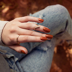 Bio Sculpture Gemini Nail Polish No. 290 Island Clay 14ml. Close-up of Island Clay polish on light skin – non-toxic, earthy terracotta shade for a stylish, contemporary nail look