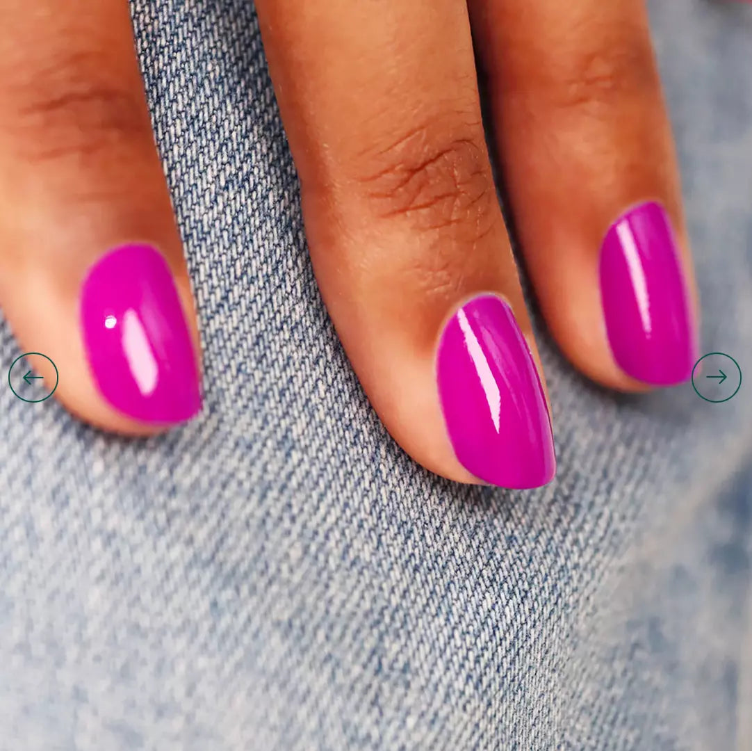 Fingers painted with Manucurist Armeria on darker skin – non-toxic, elegant pink polish for modern style