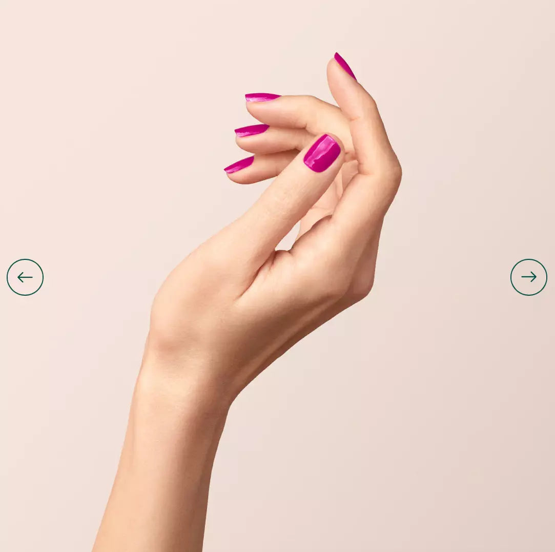 Fingers painted with Manucurist Armeria on light skin – non-toxic, pastel pink polish for timeless elegance