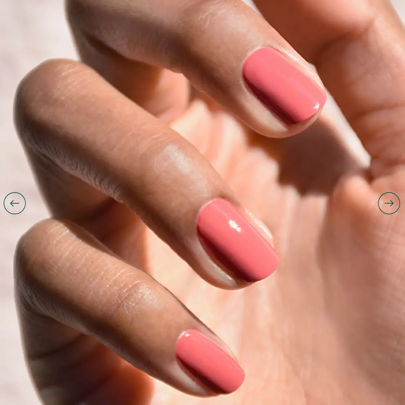 Hand with light skin tone wearing Manucurist Bois de Rose – soft, eco-friendly dusty rose polish for a refined manicure