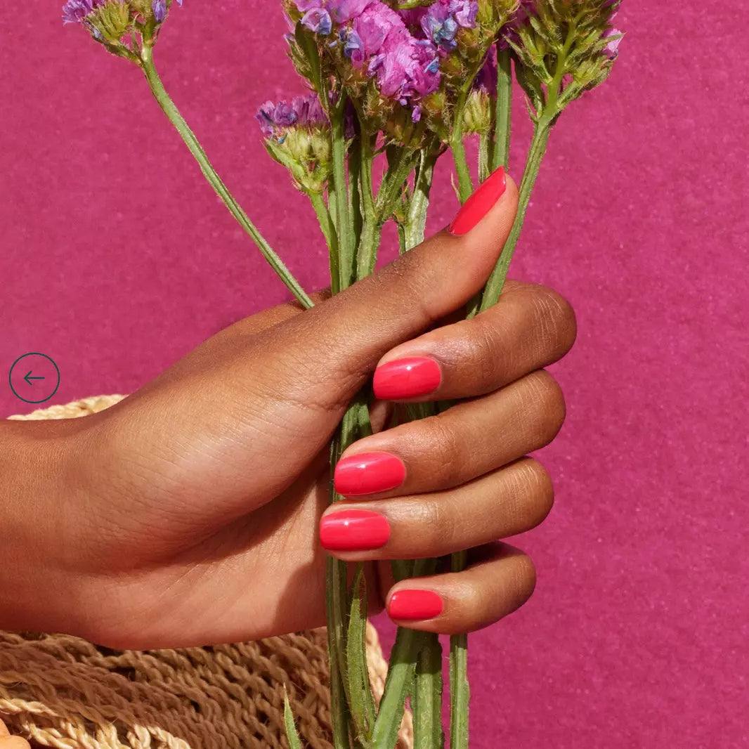 Close-up of nails painted with Bougainvillea by Manucurist Paris – lively, eco-friendly pink polish for elegant manicures
