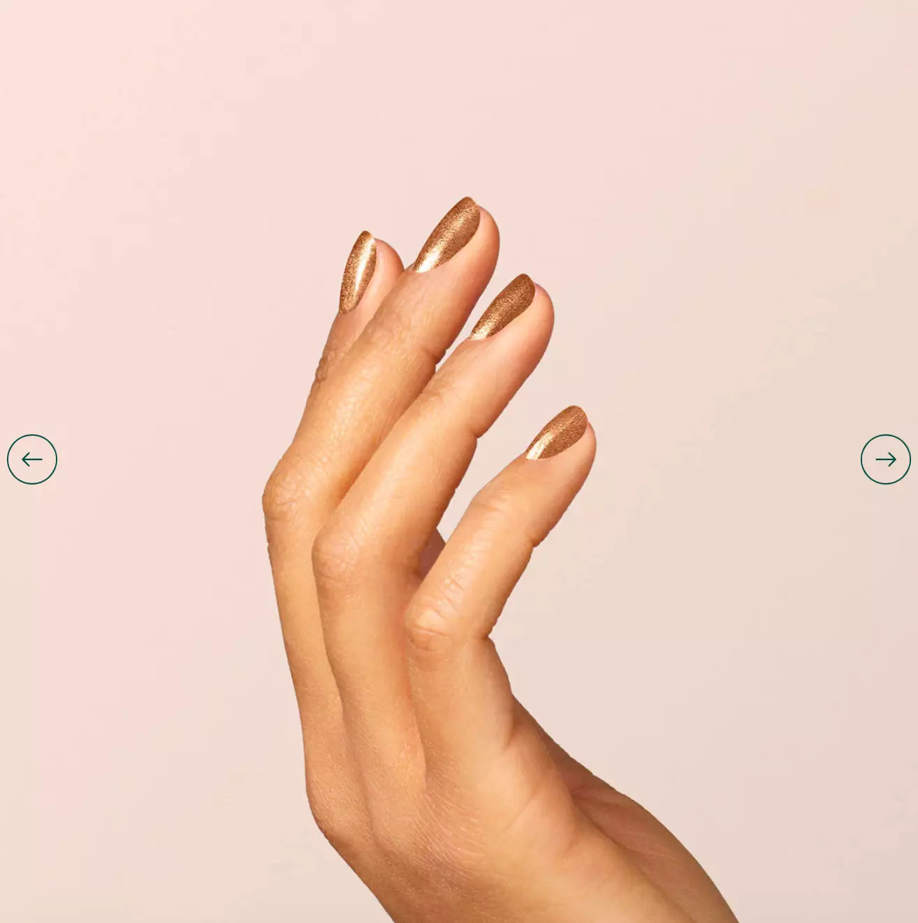 Fingers painted with Manucurist Bronzé on light skin – non-toxic, rich bronze polish for a chic, modern style