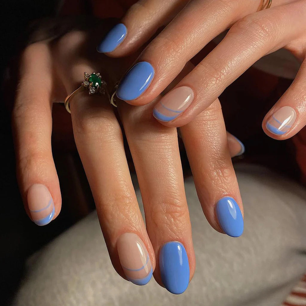 Hand wearing Bio Sculpture Gemini Nail Polish No. 197 Bohemian Beauty – bold, vegan sky blue polish for inclusive, radiant manicure