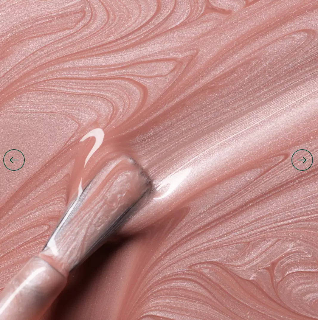 Polish brush with Manucurist Carnation nail polish – creamy, non-toxic soft pink formula for smooth application