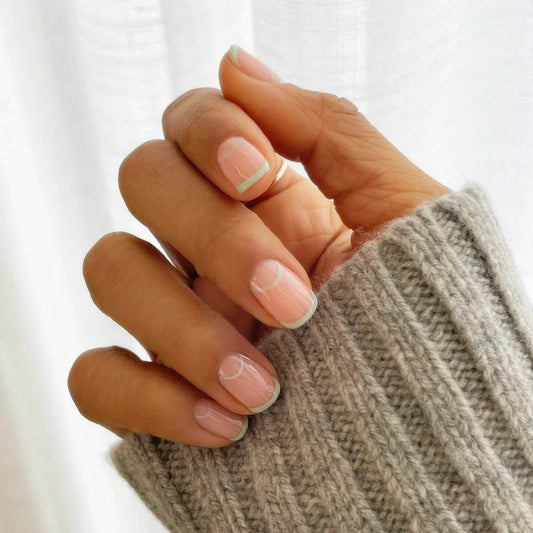 Hand with dark skin tone wearing Bio Sculpture Cloudcha – gentle, vegan pastel blue polish for inclusive, stylish manicures