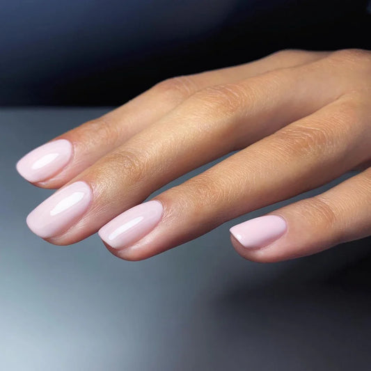 Fingers painted with Gemini Classic Jacquard on light skin – breathable, classic mauve-brown polish for everyday elegance