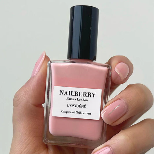 Hand with light skin tone wearing Nailberry Elegance – soft, vegan nude polish for elegant, natural-looking manicures