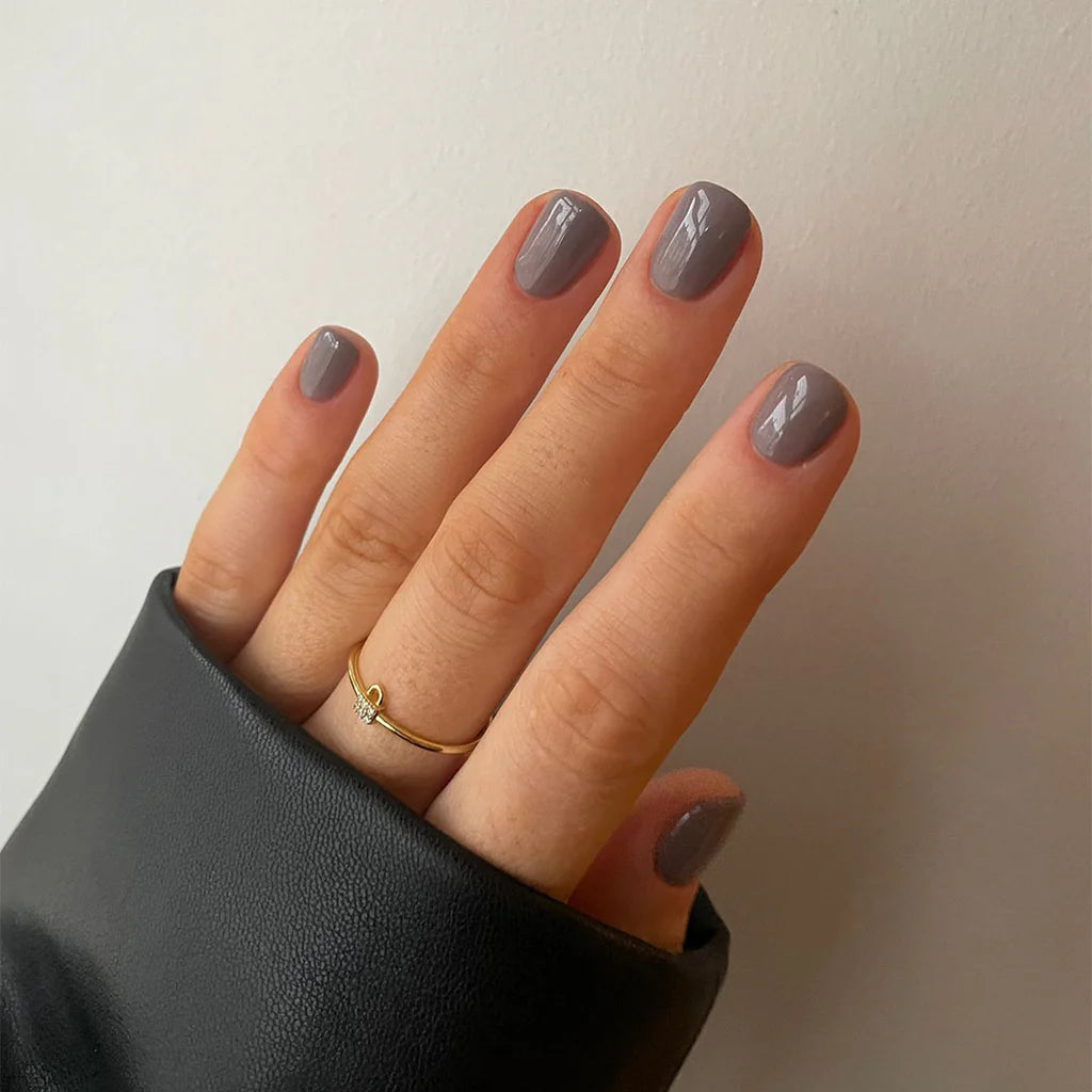Close-up of Bio Sculpture Gemini Nail Polish No. 115 Eclipse polish on light skin – non-toxic, deep black shade for a striking, modern nail look