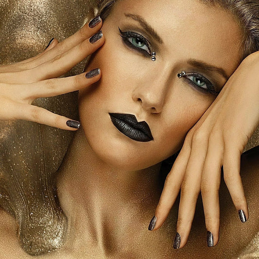 Hand with light skin tone wearing Bio Sculpture Embellished Onyx – vegan, black polish with subtle shimmer for a chic, sophisticated manicure