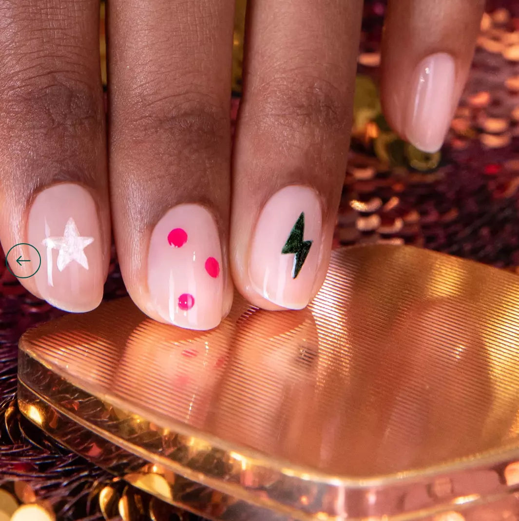 Hand with darker skin tone wearing Manucurist Fuchsia – vivid, vegan fuchsia polish for striking, inclusive manicures