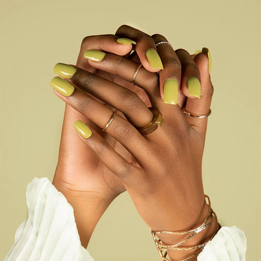Hand with dark skin tone wearing Bio Sculpture Feel the Veld – subtle, vegan earthy green polish for inclusive, stylish manicures