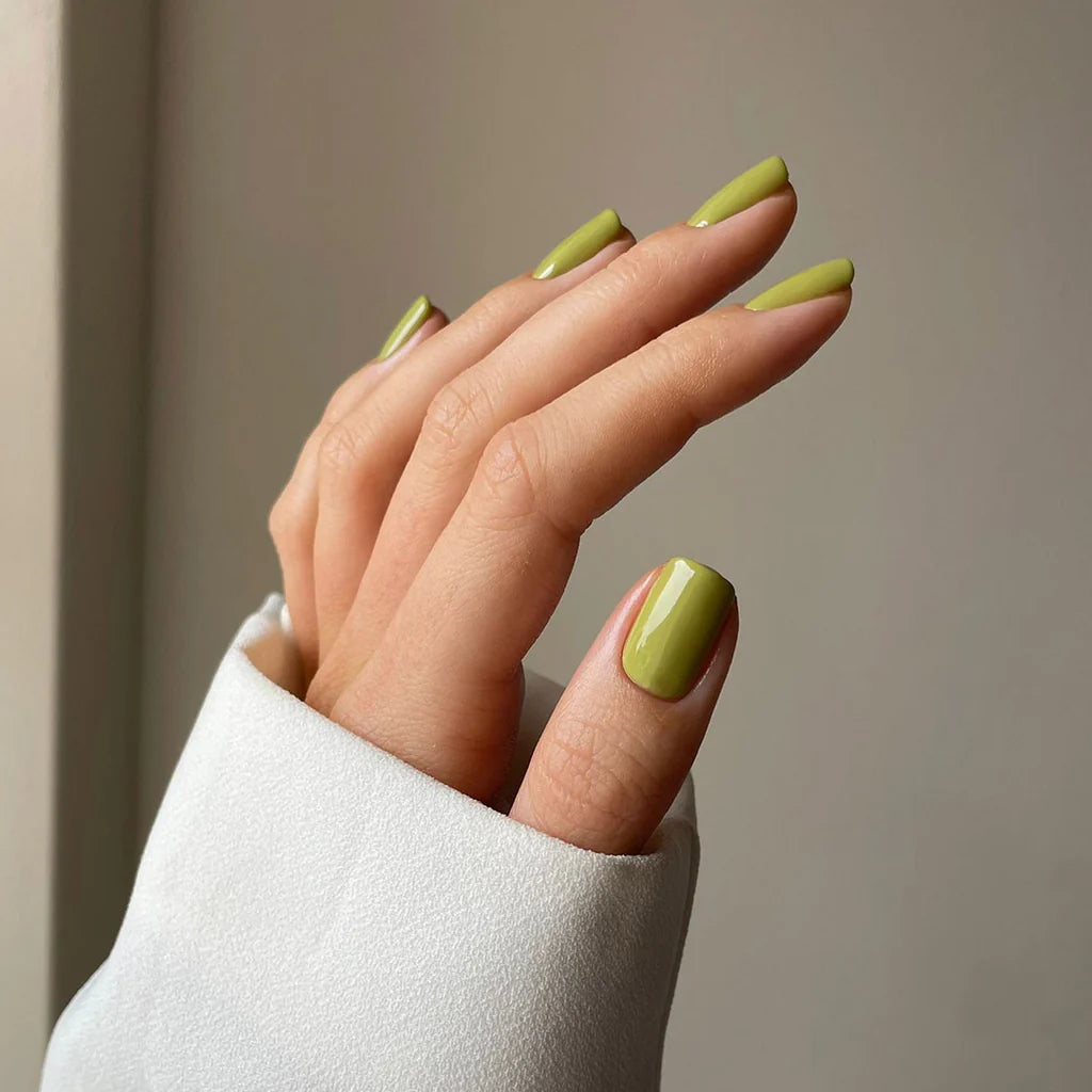 Close-up of Feel the Veld polish on light skin – non-toxic, muted green shade for a chic, understated nail look