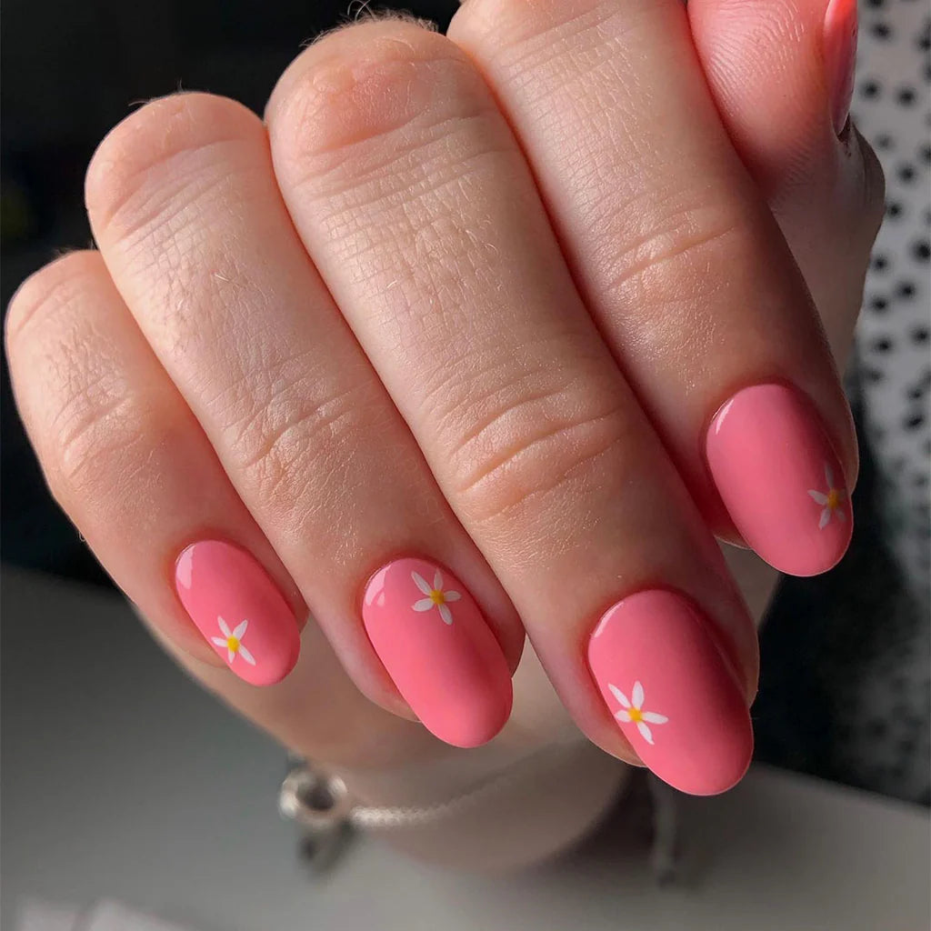 Hand wearing Bio Sculpture Gemini Nail Polish No. 195 Flower Child – bold, vegan pastel luminous pink polish for inclusive, radiant manicures