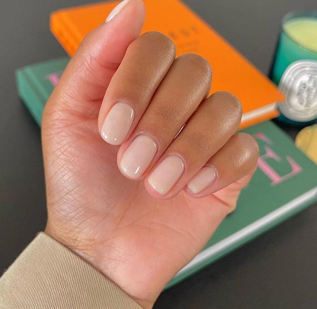 Close-up of Bio Sculpture Gemini Nail Polish No. 67 French Creme polish on light skin – non-toxic, soft off-white shade for a clean, sophisticated nail look