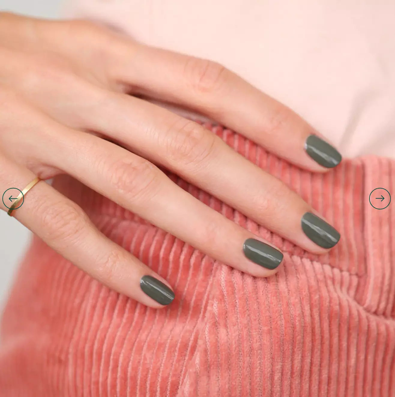 Hand with light skin tone wearing Manucurist Khaki – earthy, vegan khaki green polish for a chic, natural manicure
