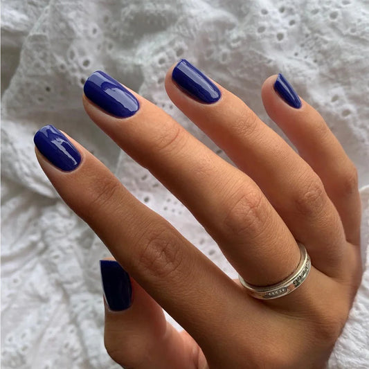 Close-up of Bio Sculpture Gemini Nail Polish No. 175 Havana Nights polish on light skin – non-toxic, rich teal blue shade for a modern, striking nail look