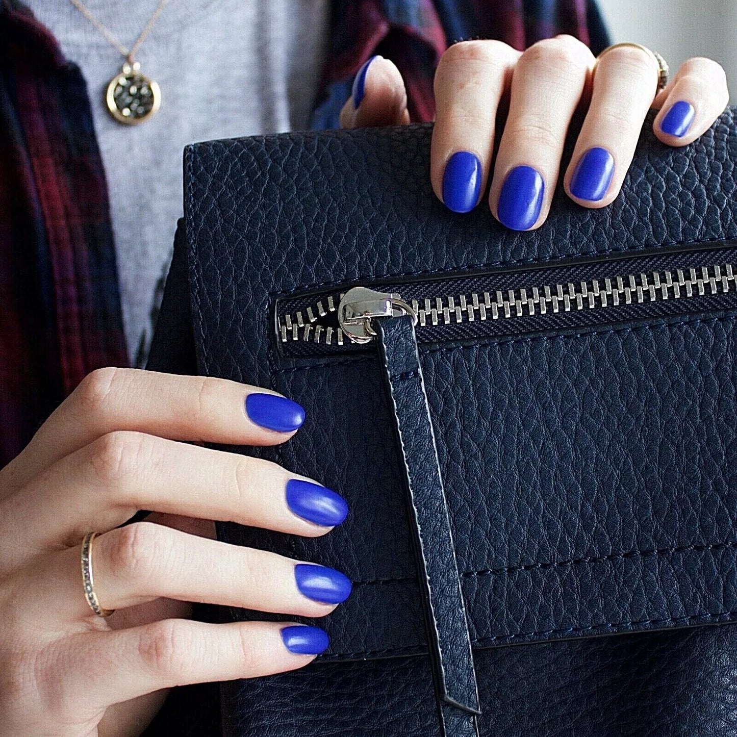 Fingers painted with Bio Sculpture Gemini Nail Polish No. 175 Havana Nights on light skin – breathable, bold teal blue polish for a polished, statement style