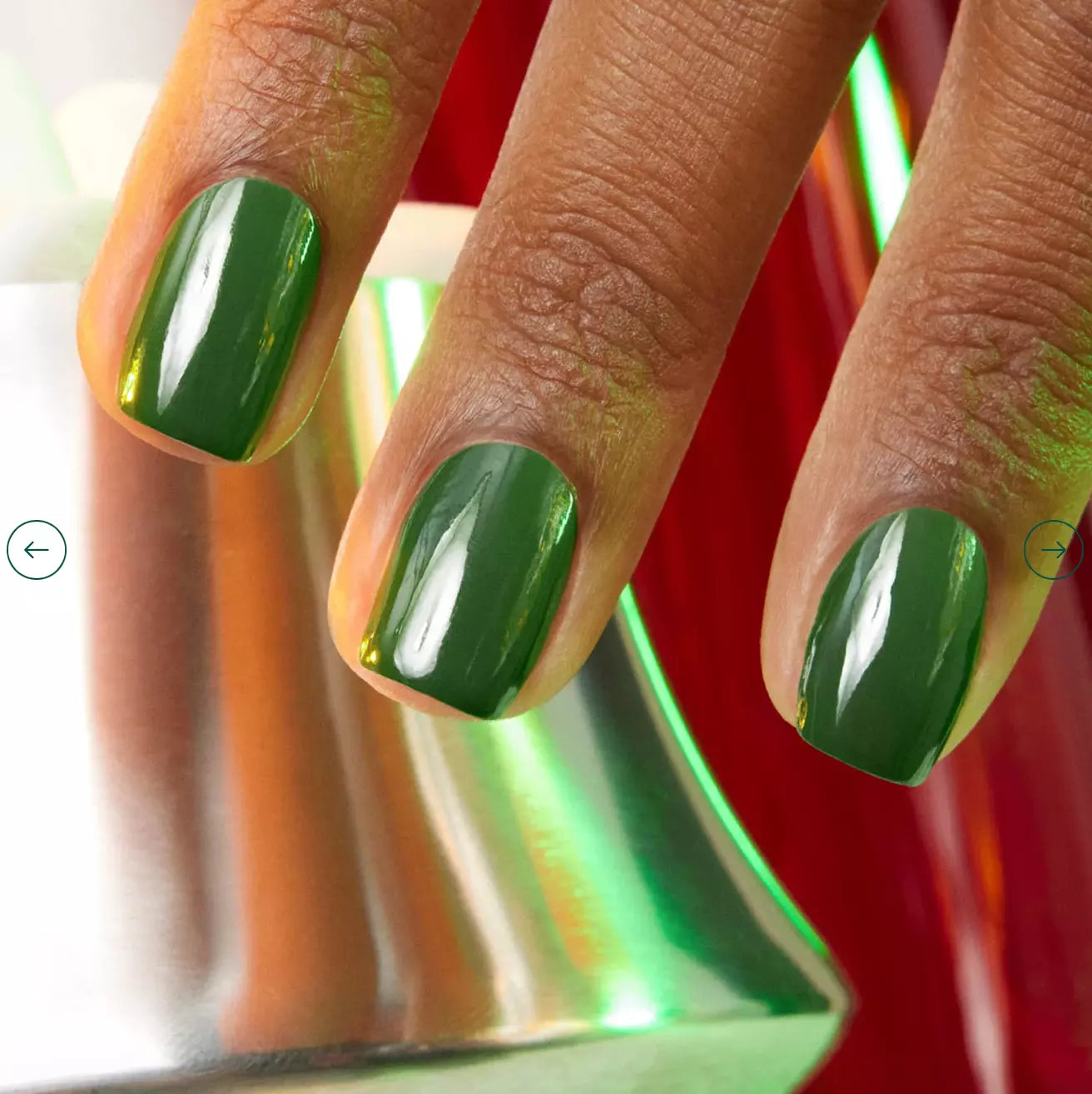 Hand with dark skin tone wearing Manucurist Jade – bold, eco-friendly jade green polish for inclusive, stylish nail looks