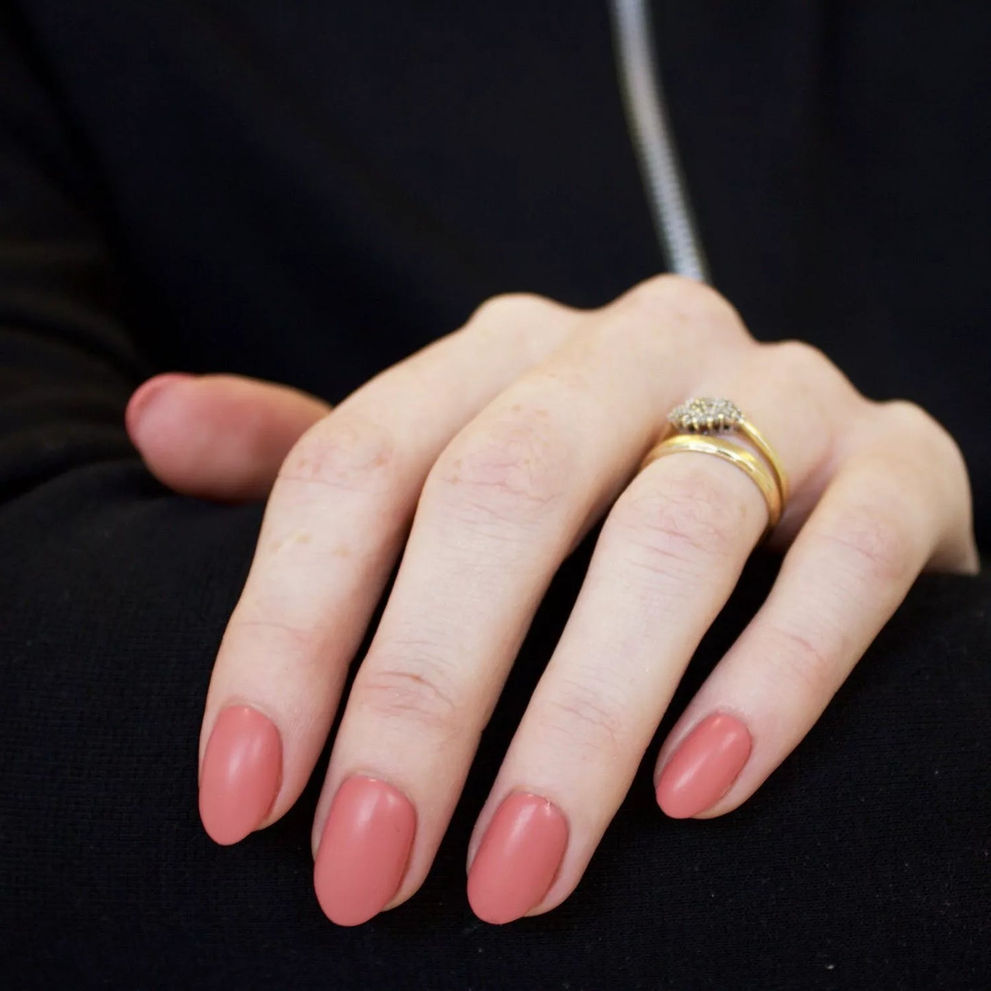 Hand with dark skin tone wearing Bio Sculpture Gemini Nail Polish No. 14 Jodi Rose – bold, vegan light dusty pink polish for inclusive, sophisticated manicures