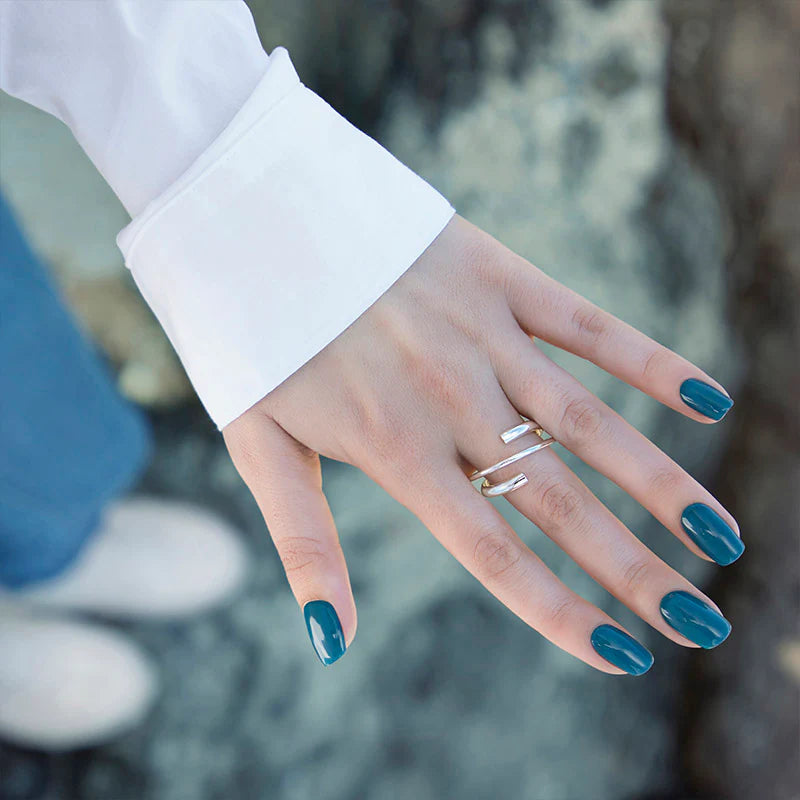 Hand with light skin tone wearing Bio Sculpture Lake Louise – soft, vegan pastel blue-green polish for a chic, modern manicure