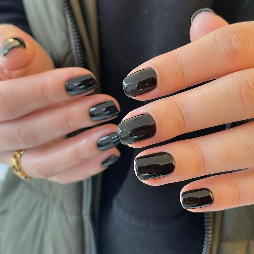 Close-up of Bio Sculpture Gemini Nail Polish No. 2017 Liquorice polish on light skin – non-toxic, deep black shade for a chic, statement nail look