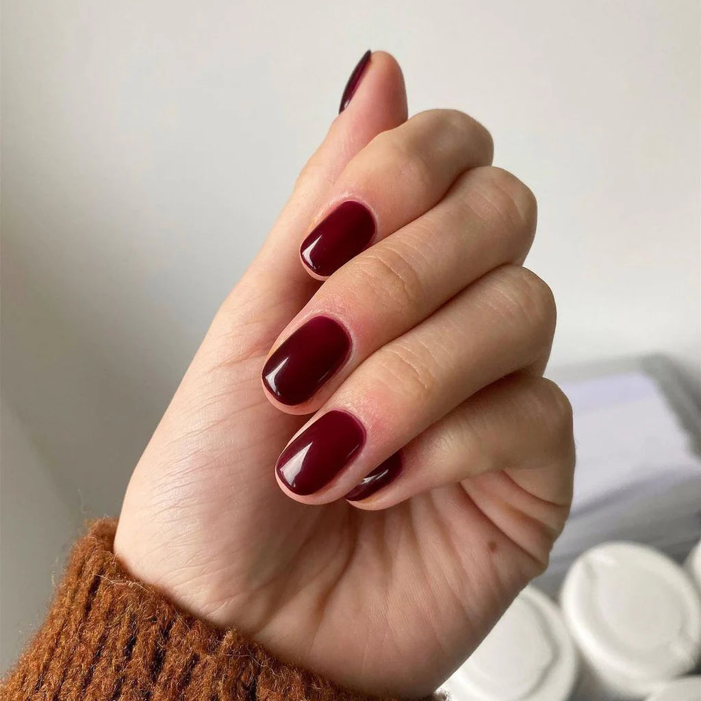 Close-up of Bio Sculpture Gemini Nail Polish No. 113 Love Potion polish on light skin – non-toxic, romantic mauve pink shade for a refined, everyday nail look