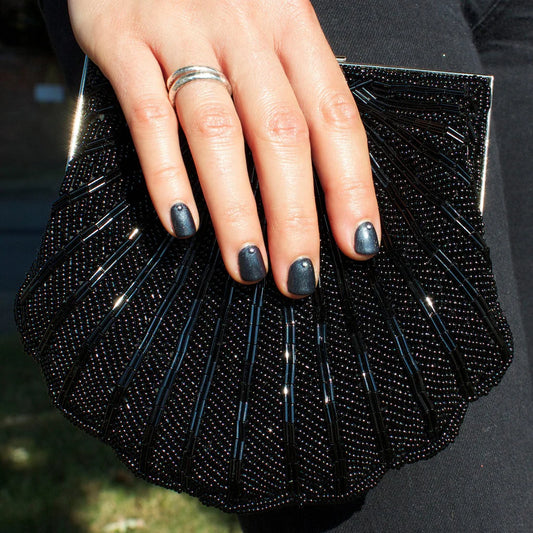 Close-up of Bio Sculpture Gemini Nail Polish No. 2035 Cast Iron polish on light skin – non-toxic, dark grey shade for a sophisticated, modern nail look