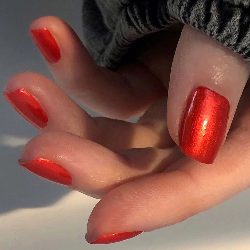 Close-up of Bio Sculpture Gemini Nail Polish No. 2058 Desert Sunset polish on light skin – non-toxic, warm terracotta orange shade for a glowing, modern nail look