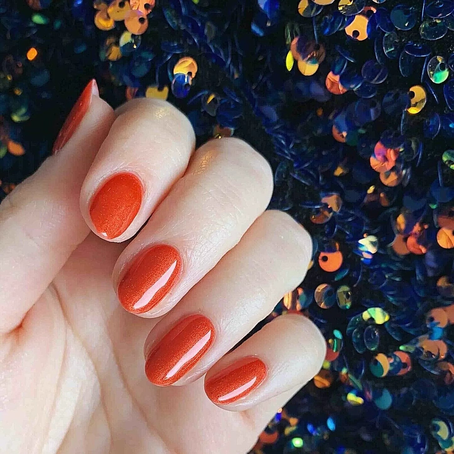 Nails featuring Bio Sculpture Gemini Nail Polish No. 2058 Desert Sunset on light skin – cruelty-free, warm terracotta orange polish for a sophisticated, sunset-inspired finish