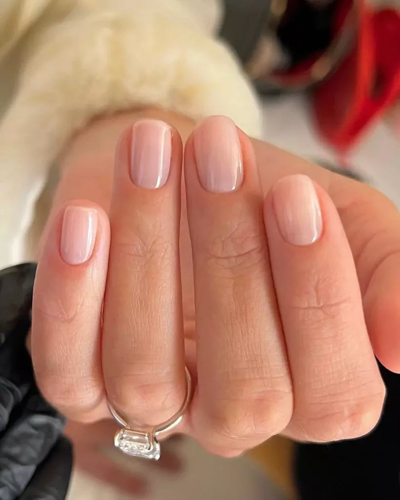Close-up of Bio Sculpture Gemini Nail Polish No. 2065 Sweet Candy Breath polish on light skin – non-toxic, soft candy pink shade for a delicate, everyday nail loo