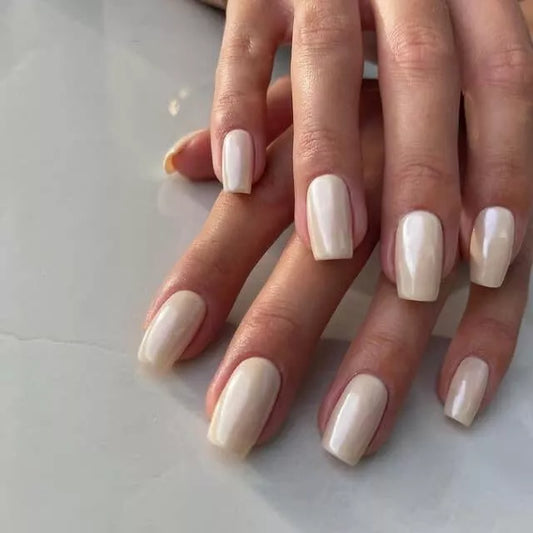 Fingers painted with Gemini Crescent Moon on dark skin – non-toxic, soft grey polish for a chic, versatile look