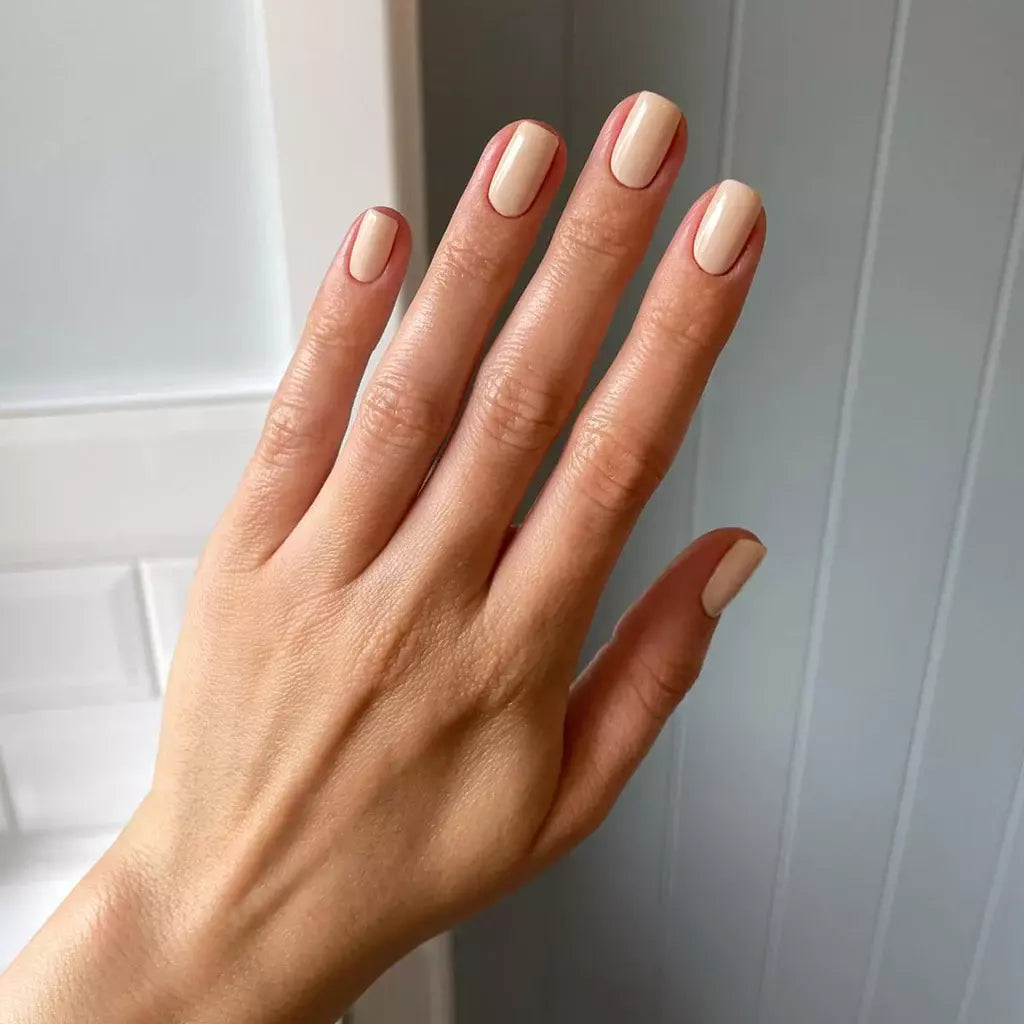 Close-up of Crescent Moon polish on light skin – non-toxic, muted grey shade for a sophisticated nail look