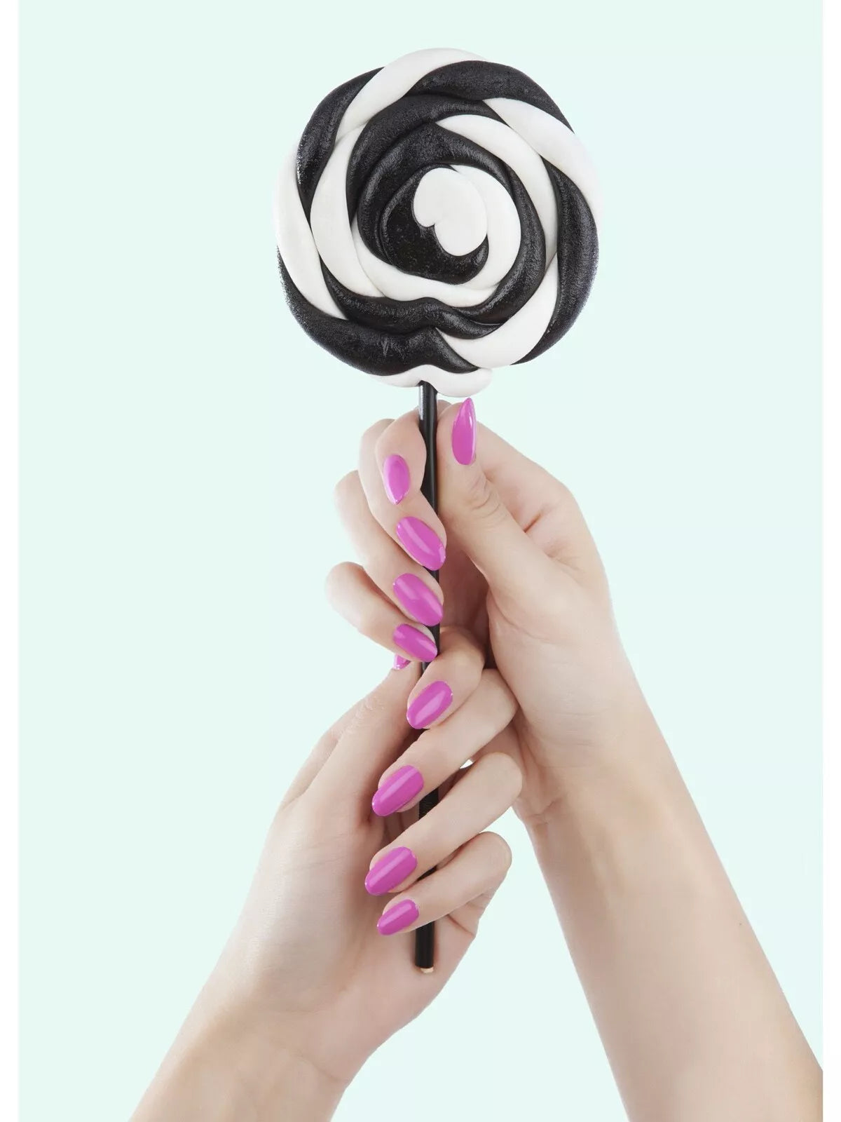 Hand wearing Bio Sculpture Gemini Nail Polish No. 207 Party Animal – bold, vegan vibrant purpley pink polish for inclusive, striking manicures