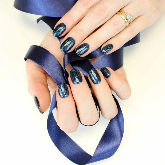 Close-up of Bio Sculpture Gemini Nail Polish No. 237 Platinum Sparkle polish on light skin – non-toxic, sparkling platinum silver glitter for a radiant, party-ready nail look