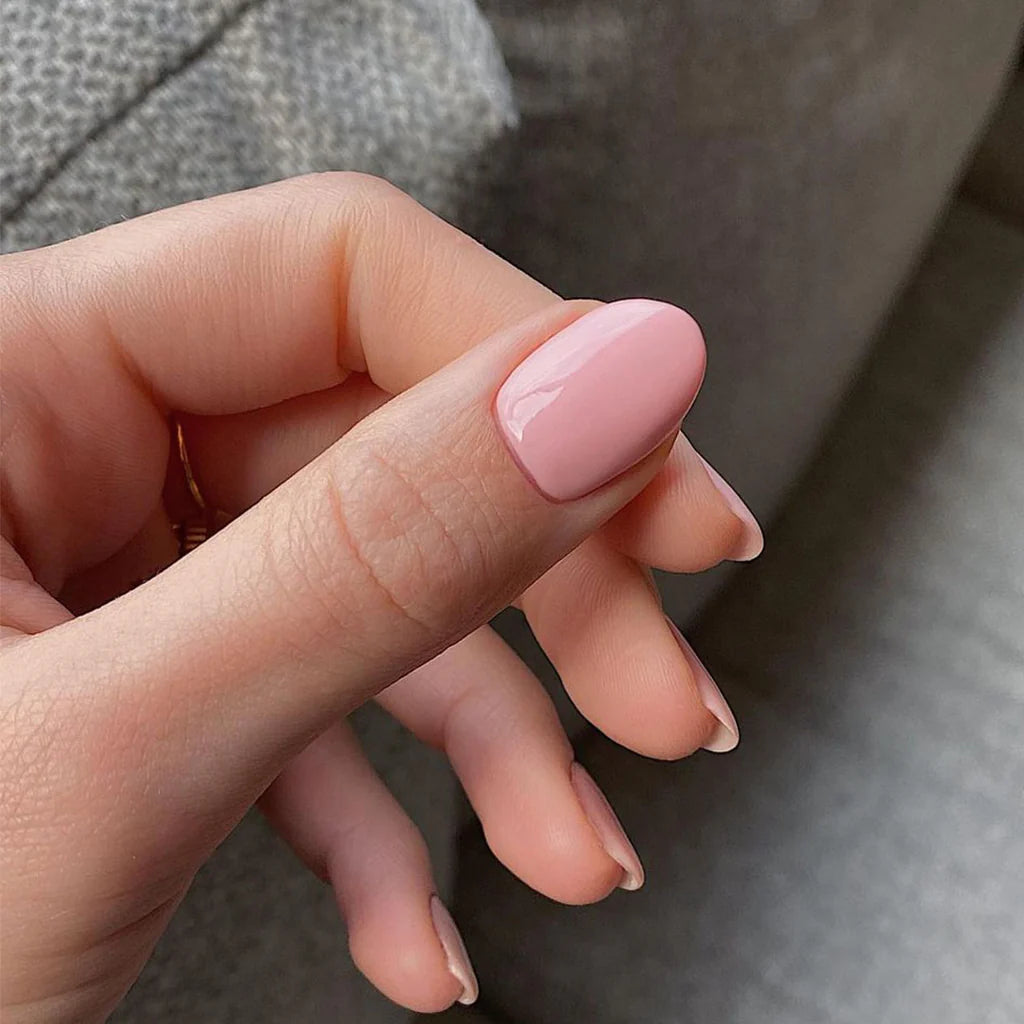 Fingers painted with Bio Sculpture Gemini Nail Polish No. 270 Cheery Blossom on light skin – breathable, cherry blossom pink polish for a subtle, everyday style