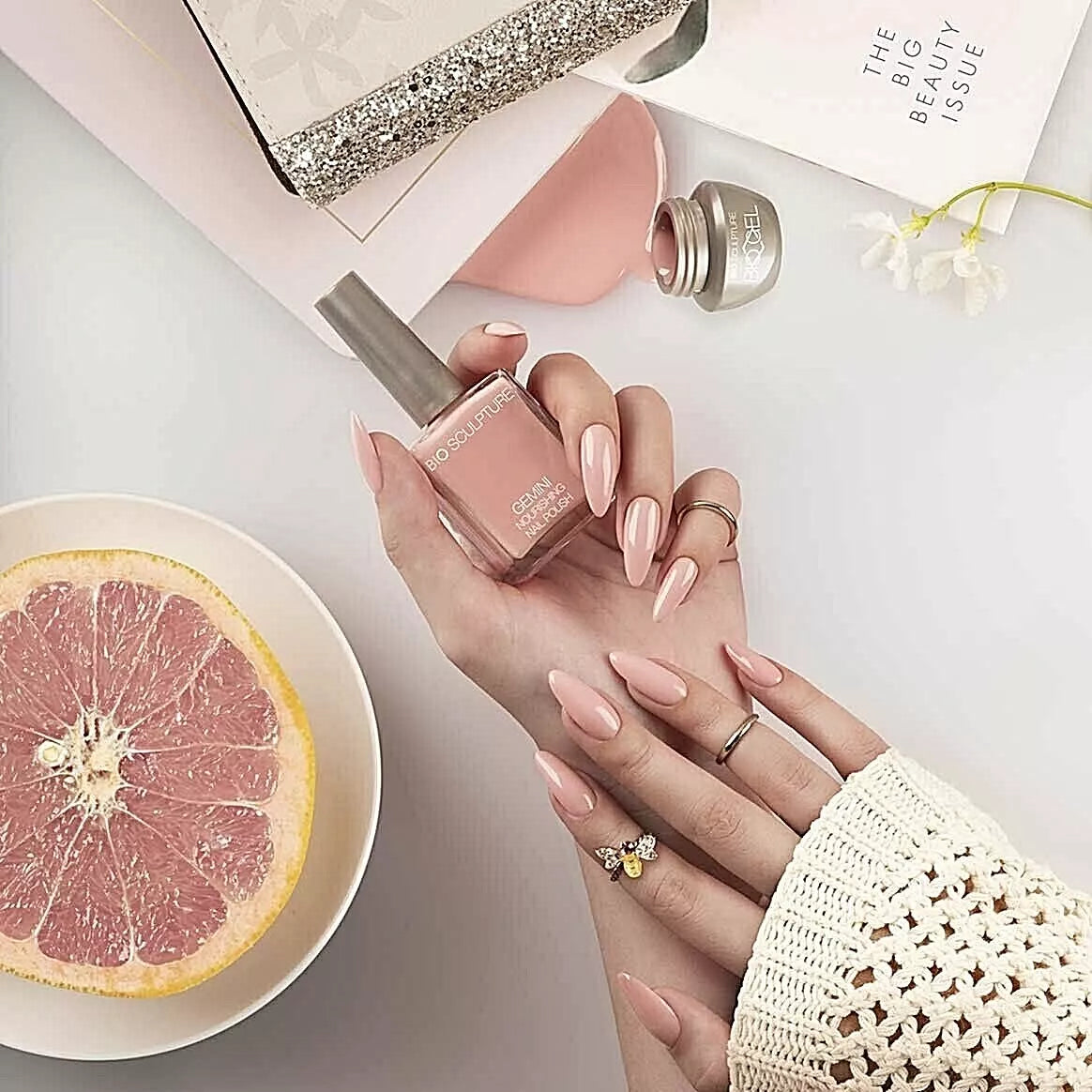 Close-up Bio Sculpture Gemini Nail Polish No. 270 Cheery Blossom polish on light skin – non-toxic, soft pink shade for a delicate, modern nail look