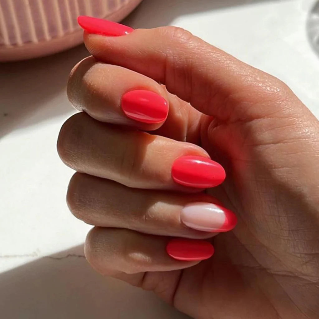 Fingers painted with Gemini Polish No. 284, Retro Rock on light skin – breathable, berry red polish for a fun, everyday style
