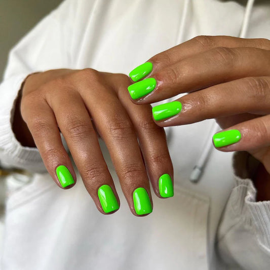 Hand with light skin tone wearing Bio Sculpture Limelight – bright, vegan lime green polish for a striking, trendy manicure
