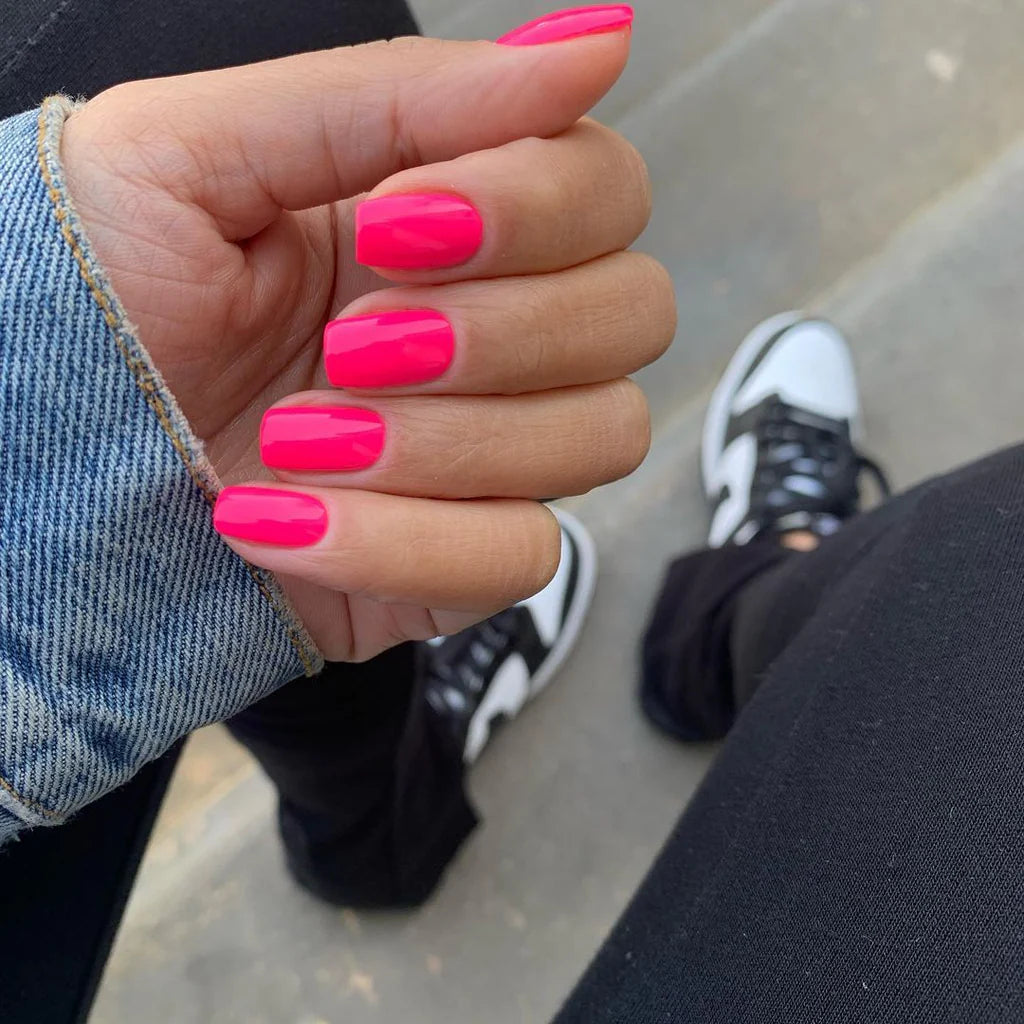 Close-up of Bio Sculpture Gemini Nail Polish No. 287, Belle of the Bop polish on light skin – non-toxic, vibrant fuchsia shade for a chic, statement nail look
