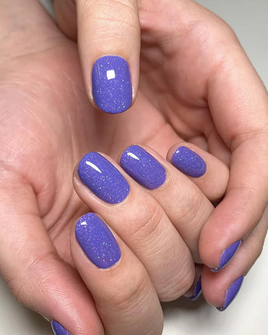 Nails featuring Bio Sculpture Very Peri on light skin – cruelty-free, periwinkle polish for a polished, contemporary finish