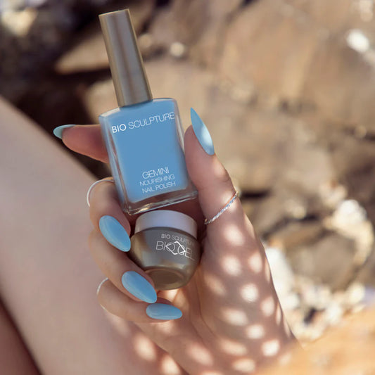 Hand with Bio Sculpture Gemini Nail Polish No. 303 Bubblegum Ice Cream 14ml. Playful bubblegum blue vegan polish for a fresh, fun manicure