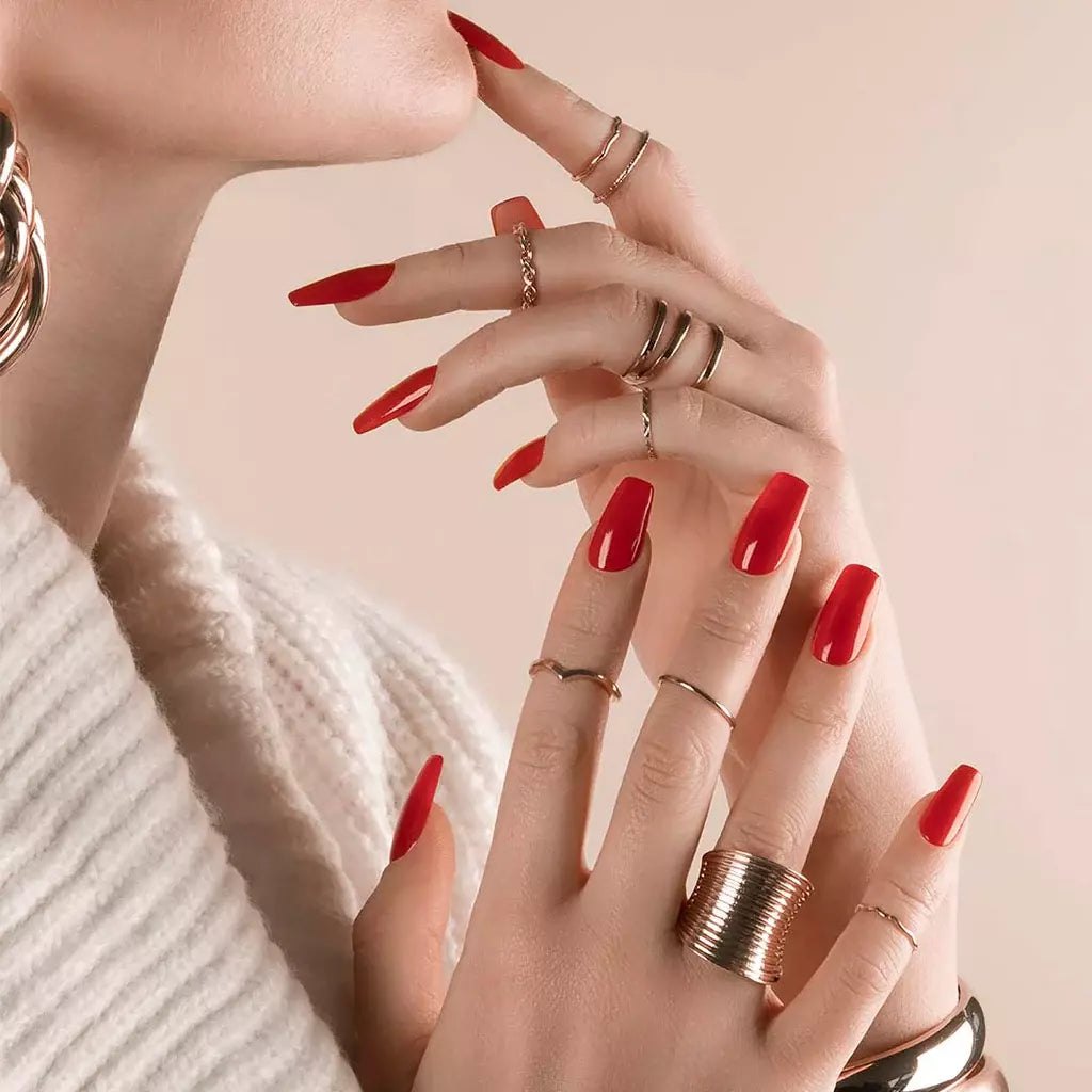 Nails featuring Bio Sculpture Sunset Red on light skin – cruelty-free, sunset red polish for a polished, confident finish
