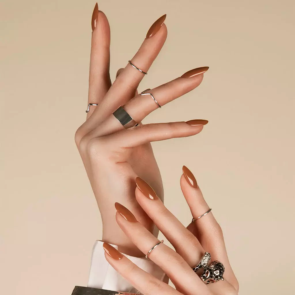 Hand with light skin tone wearing Bio Sculpture Dust at Dusk – soft, vegan taupe polish for an elegant, understated manicure
