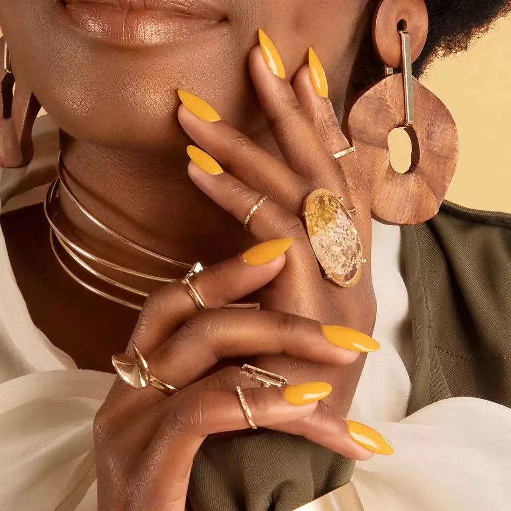 Close-up of Golden Hour polish on light skin – non-toxic, golden yellow shade for a cheerful, elegant nail look