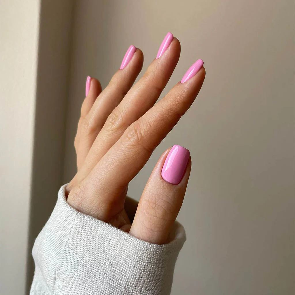 Close-up of Flower in Flight polish on light skin – non-toxic, pastel blue shade for a delicate nail look