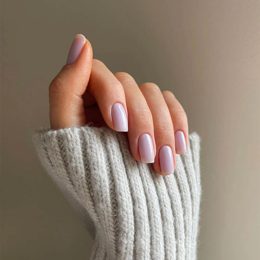 Hand with light skin tone wearing Bio Sculpture Fluttering Lavender – soft, vegan lavender polish for a chic, delicate manicure